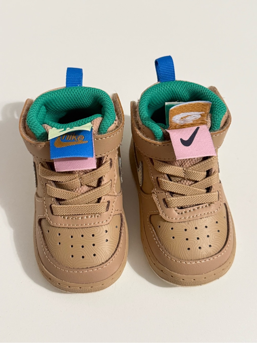 Nike Kids Tan High-Top Sneakers with Green Lining and Pink/Blue Accents